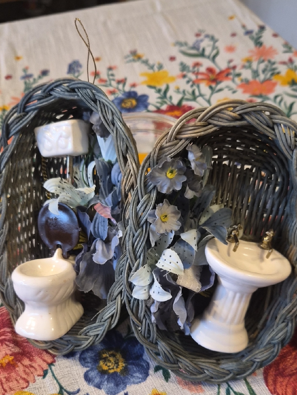 Miniature Wicker Baskets with Ceramic Bathroom Fixtures and Blue Floral Accents